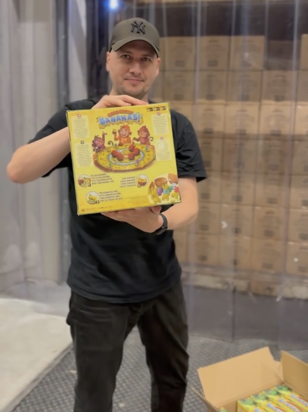 Morten Weilbach holding a Coco Crazy Bananas game at the warehouse
